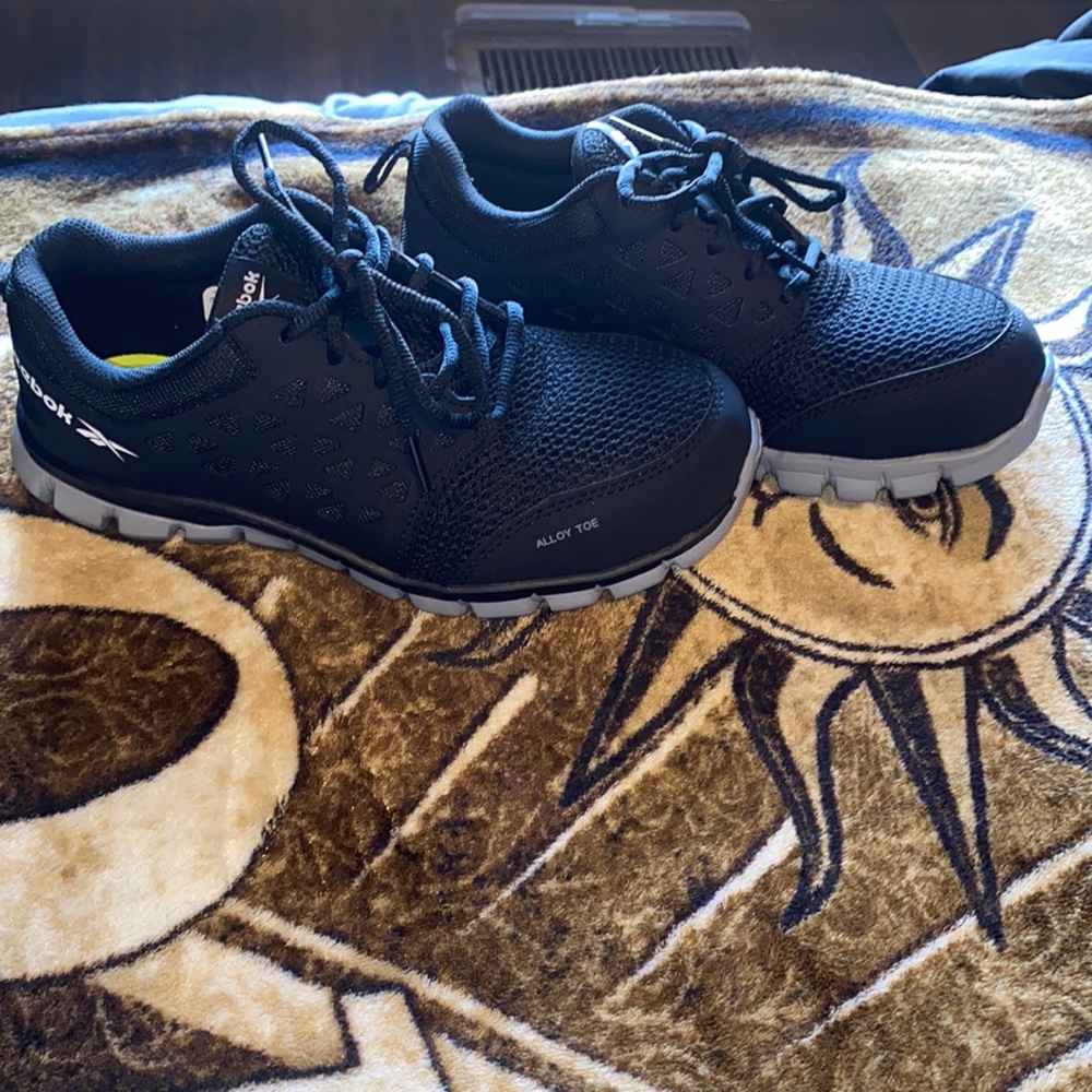 Women’s steel toed Reeboks